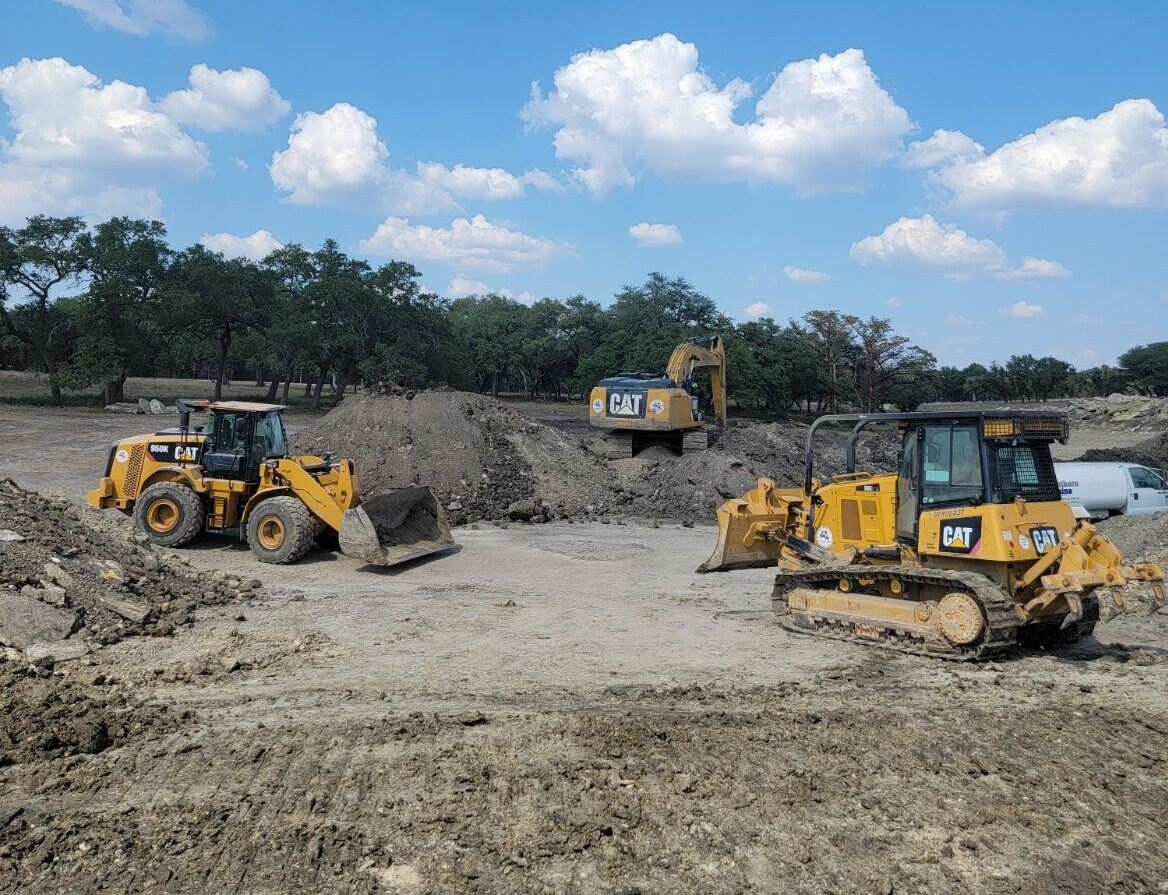 CAT dozer and loader shaping a lake bottom